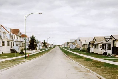 The same Winnipeg street after Dutch elm disease, with no trees along the road